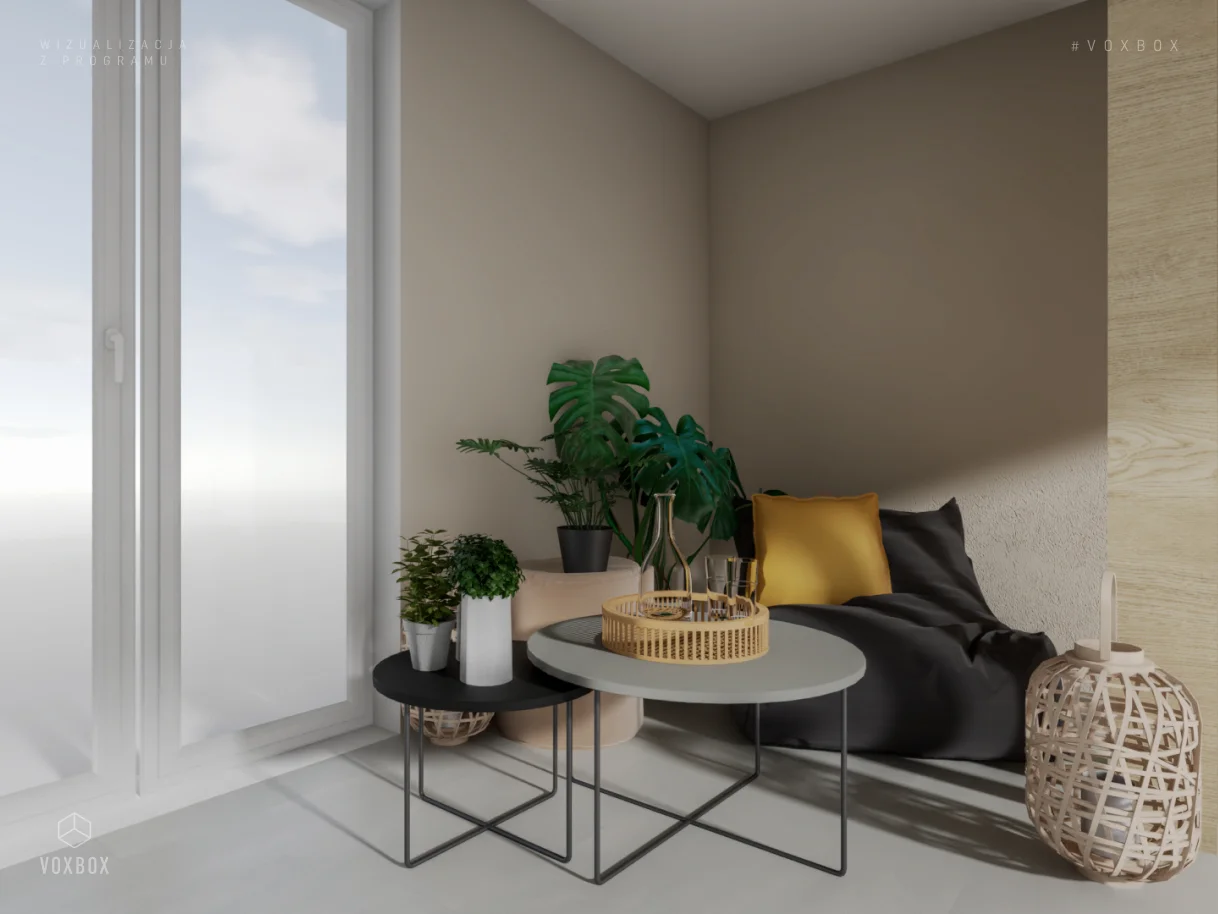 Przytulny balkon z pufą, stolikami  i roślinami doniczkowymi